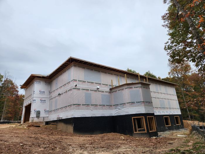 Building shell and graded site during early construction