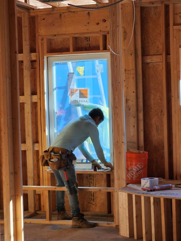 Low-voltage and device wiring being installed within framed walls