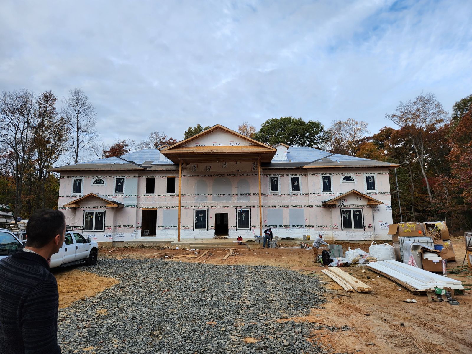 Front elevation of a residence under construction during exterior finishing