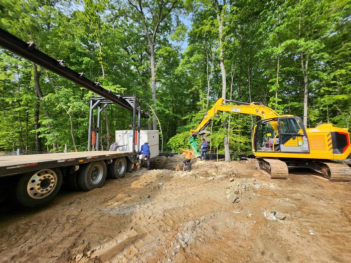 Materials delivered to site by flatbed alongside site plant