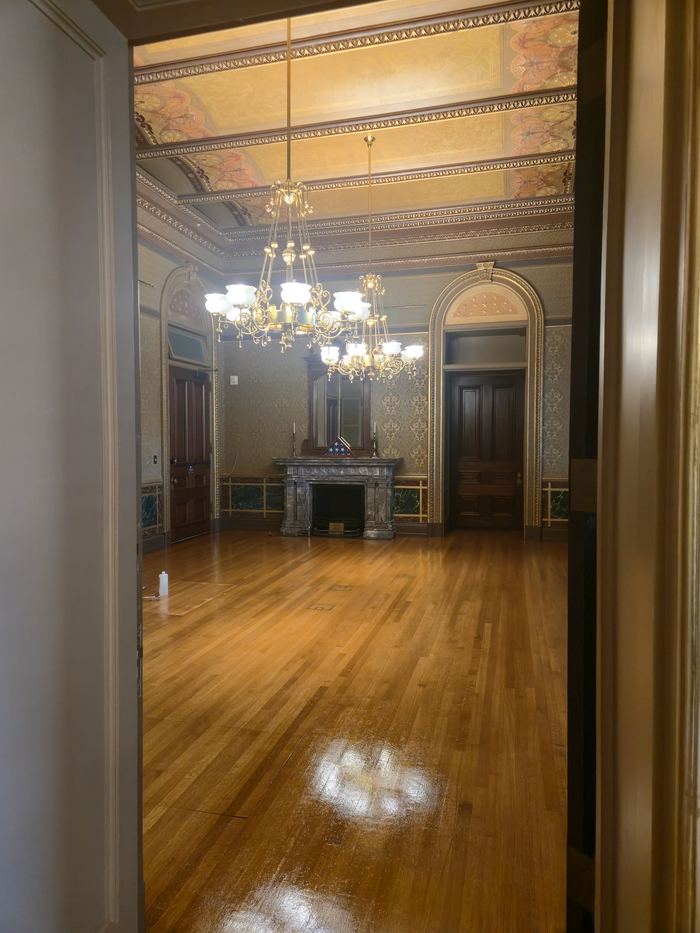 Refinished parquet flooring in a decorated historic room
