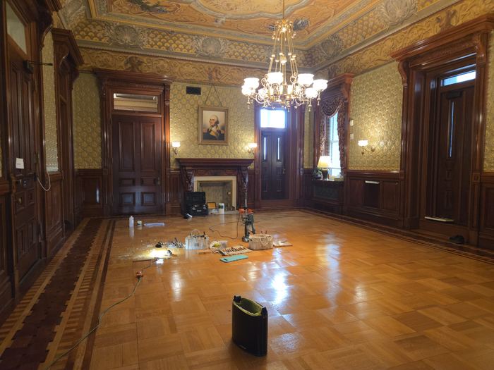 Floor refinishing in progress in an occupied building