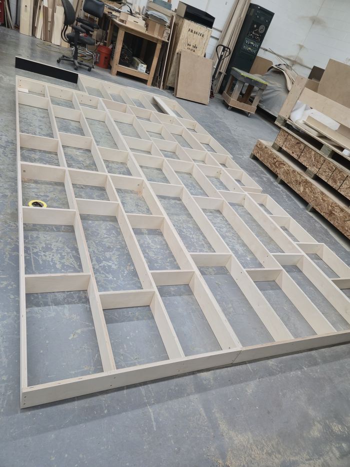 Interior wall panel installation during a building refresh