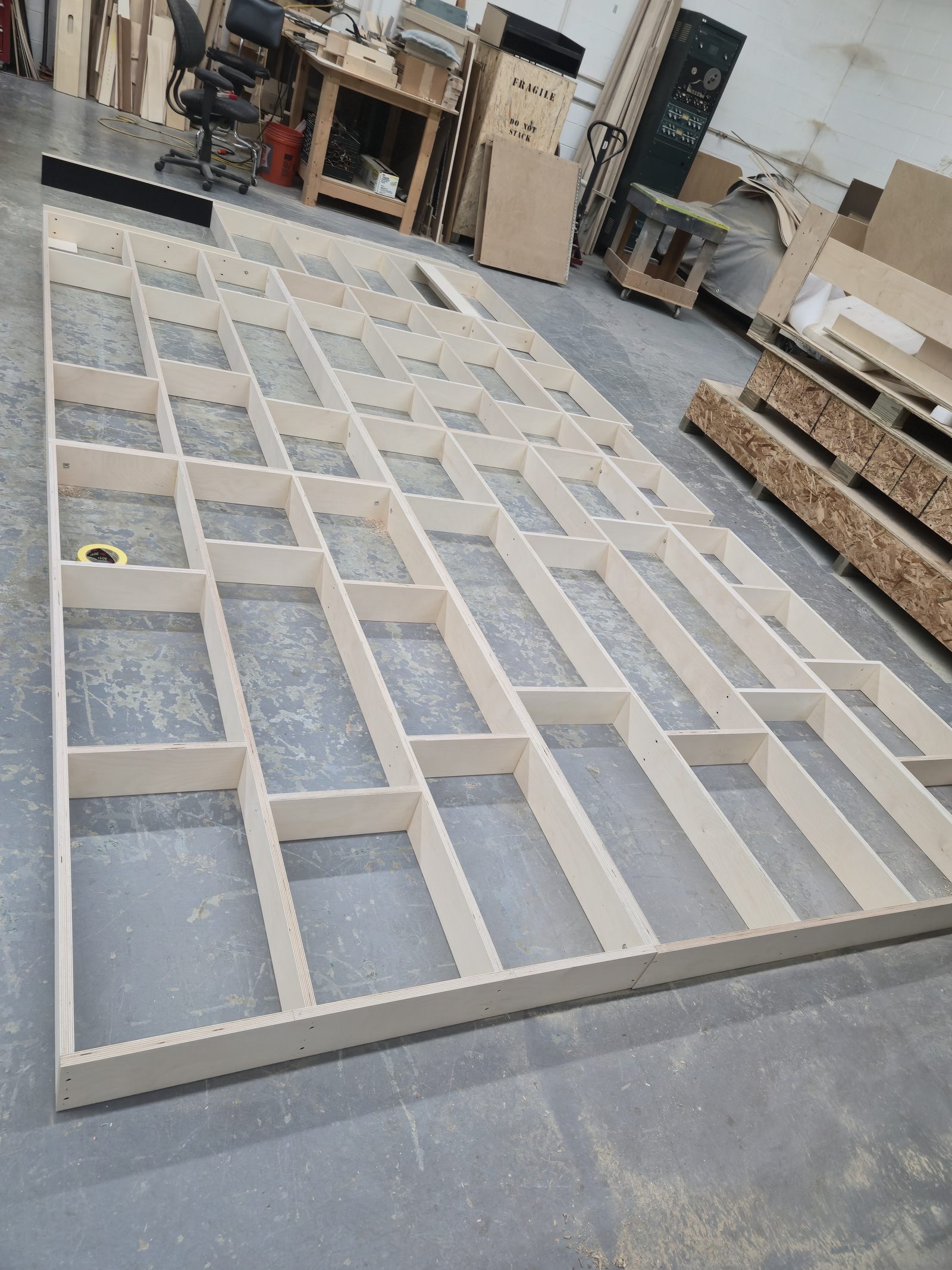 Wall panel installation during interior fit-out of an institutional building