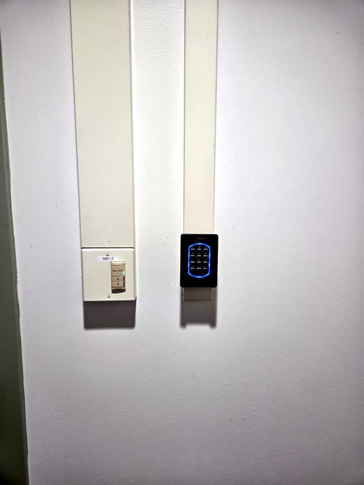 Wall-mounted reader installation with surface conduit
