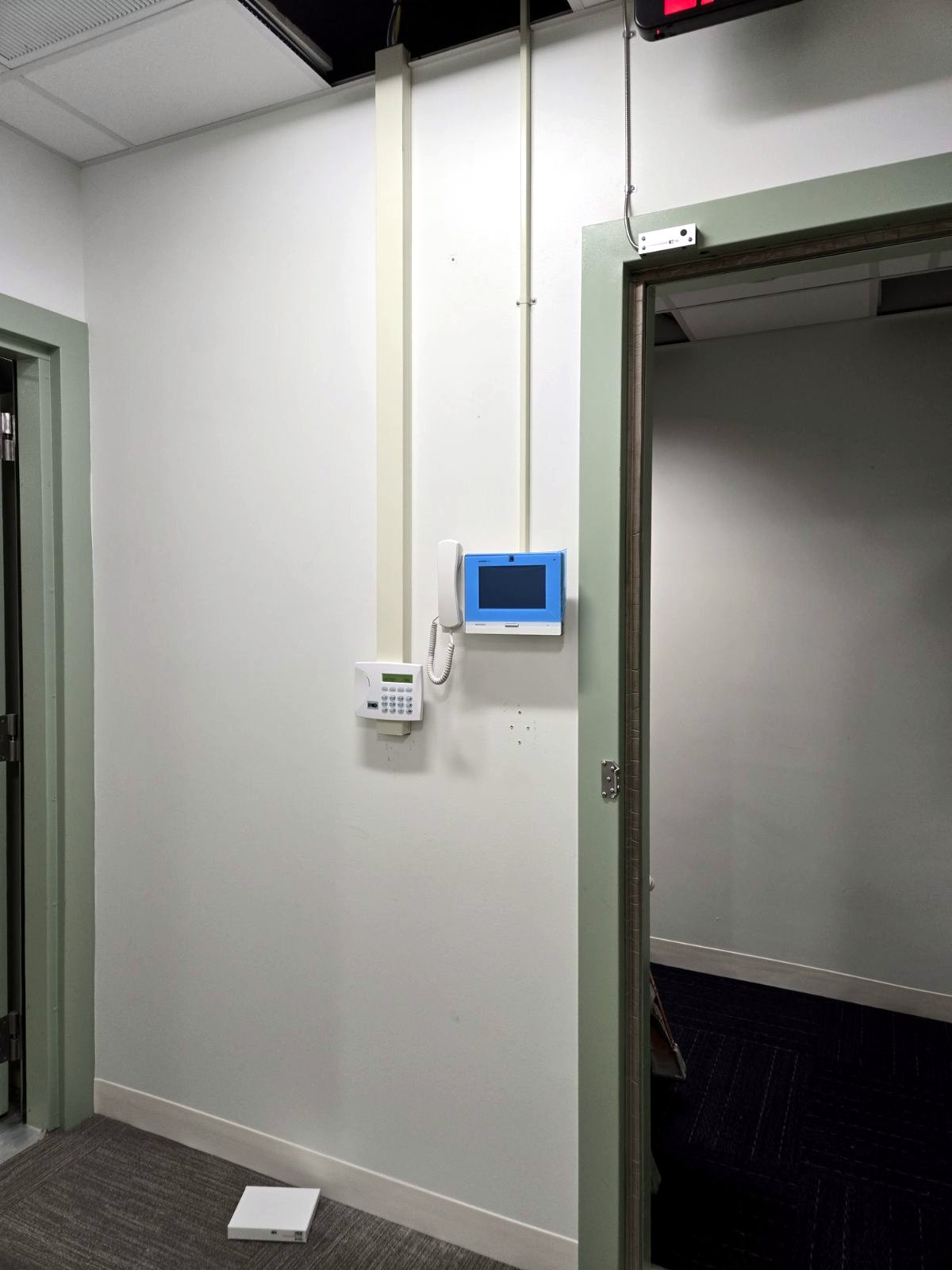 Intercom and entry panel installed at a secure door